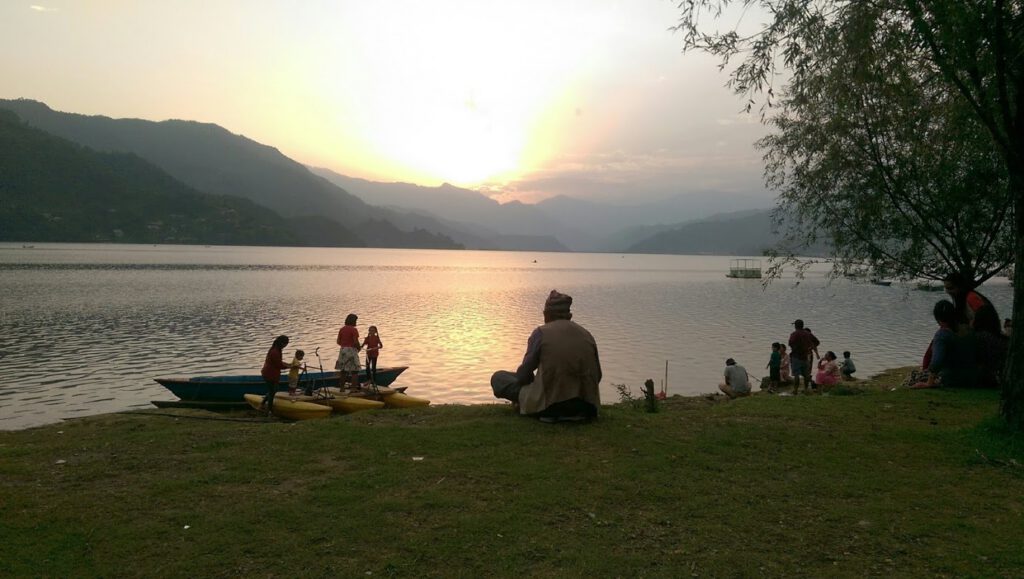 Local man looking over Phewa Lake in Pokhara (cr. Paul Cowey)