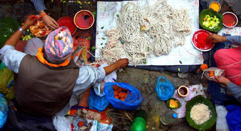Local man working with threads at Janaipurnima festival in Nepal