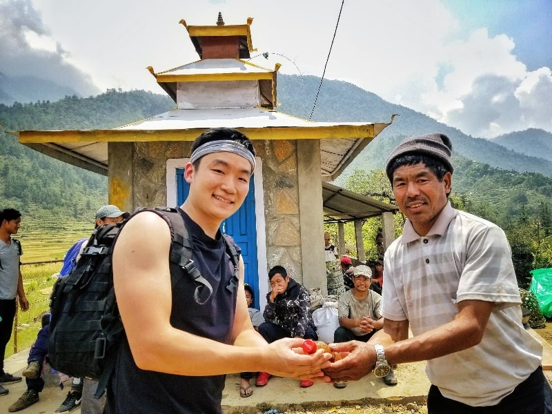 greeting a traveller in Narchyang, Nepal